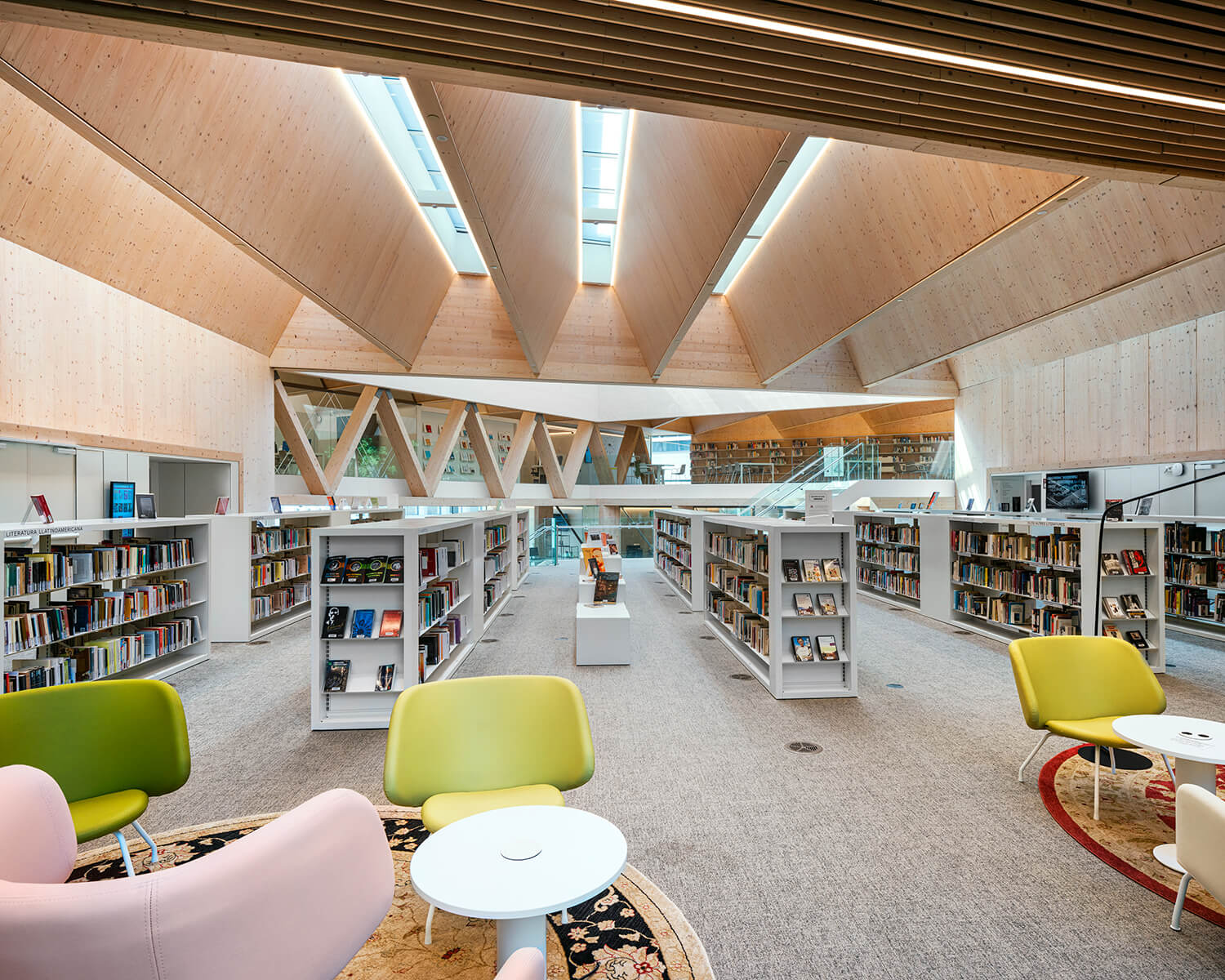 The library’s permeable timber structure allows natural light to filter into the fourth-floor reading space.